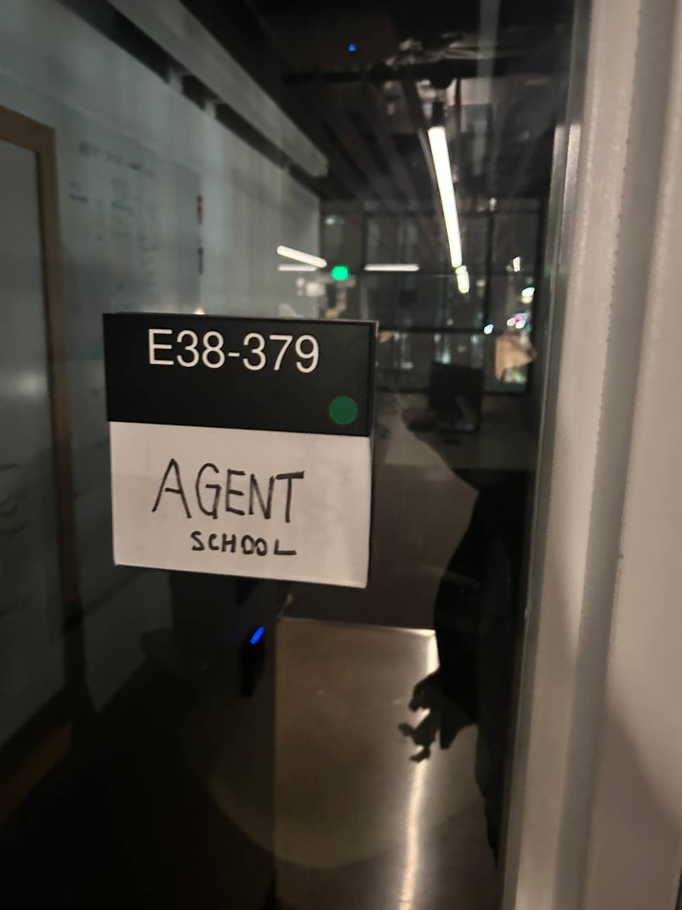 Agent School door sign, E38-379 — night
