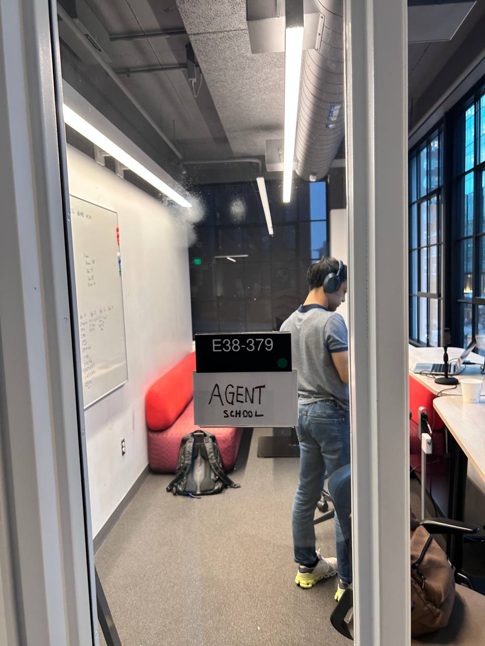 Agent School room interior — someone working at standing desk