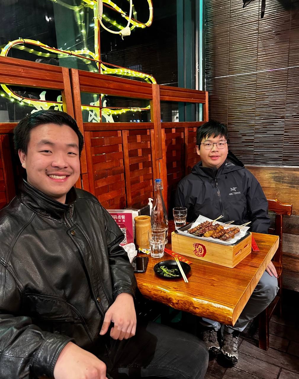 Jack and a friend at a Chinese BBQ restaurant