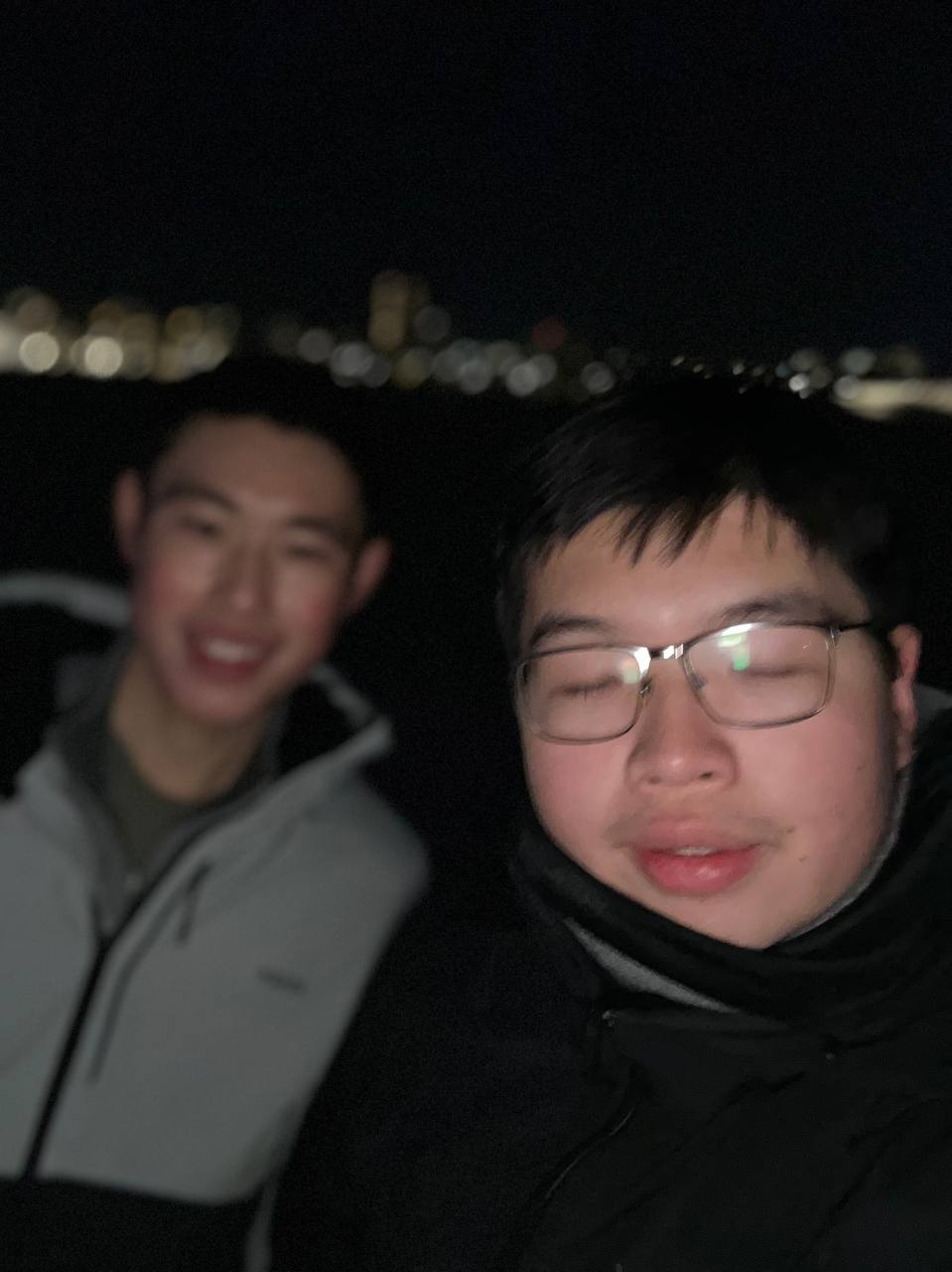 Jack with a friend in the city at night